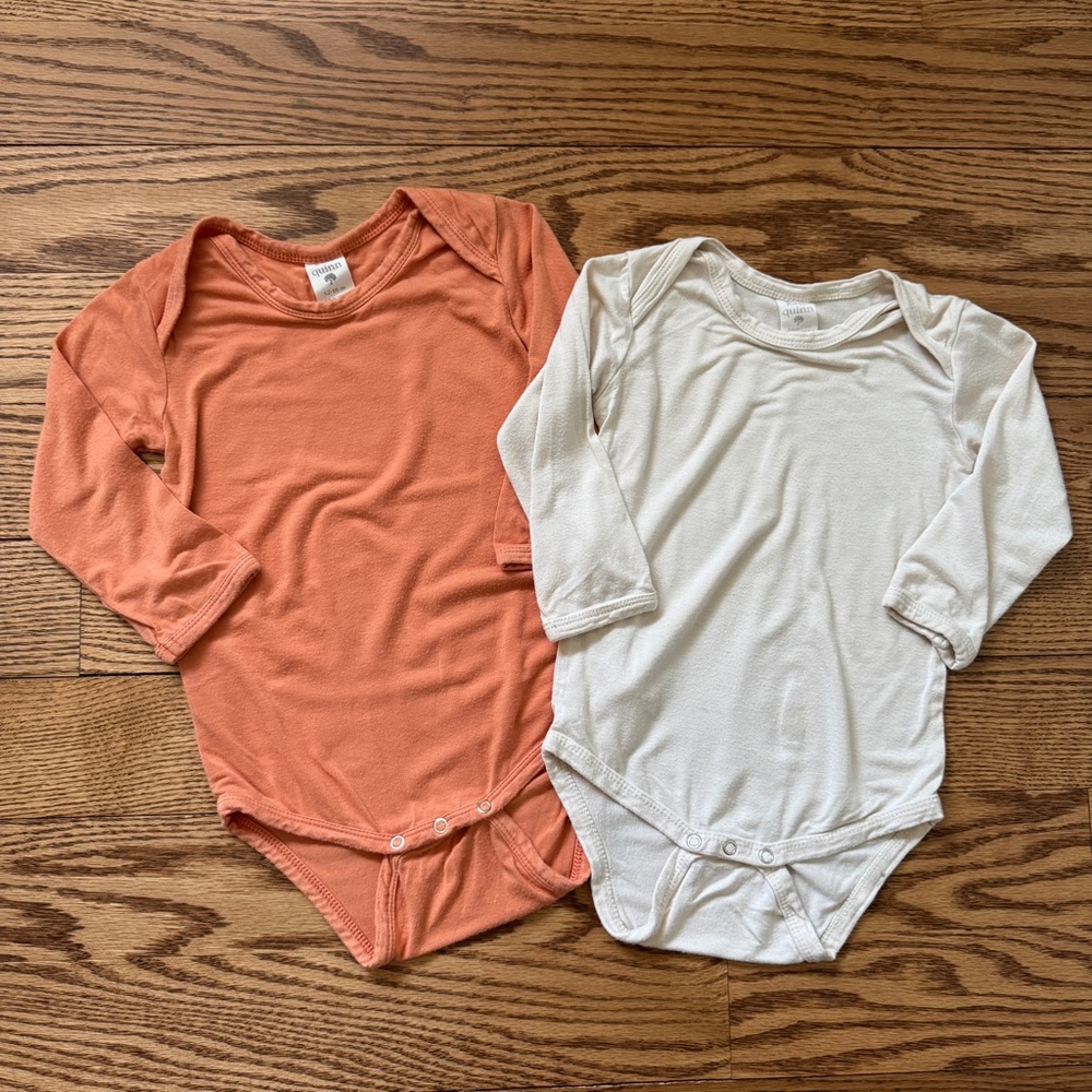 Kate Quinn Play Condition Long-Sleeve One-Piece Bodysuits in Coral and Cream